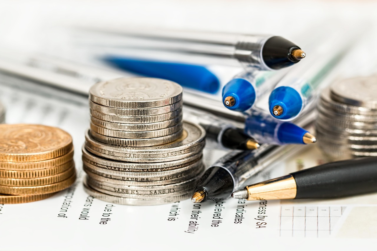 A luxury pen resting on a signed personal bank check