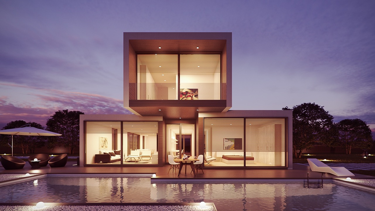 Contemporary luxury home with large glass windows and pool