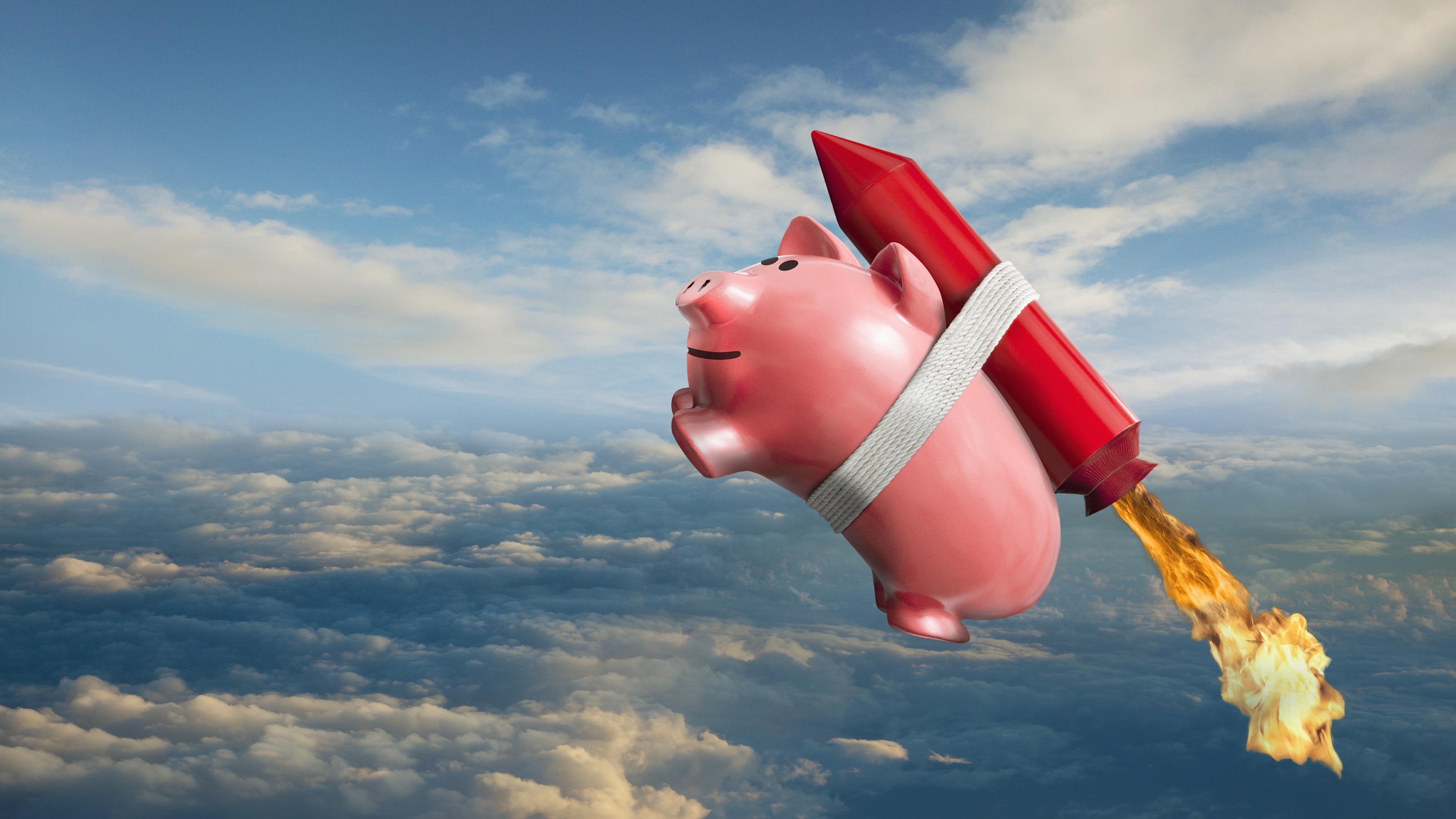 A pink piggy bank with a cartoon rocket strapped to its back flying into the blue sky.