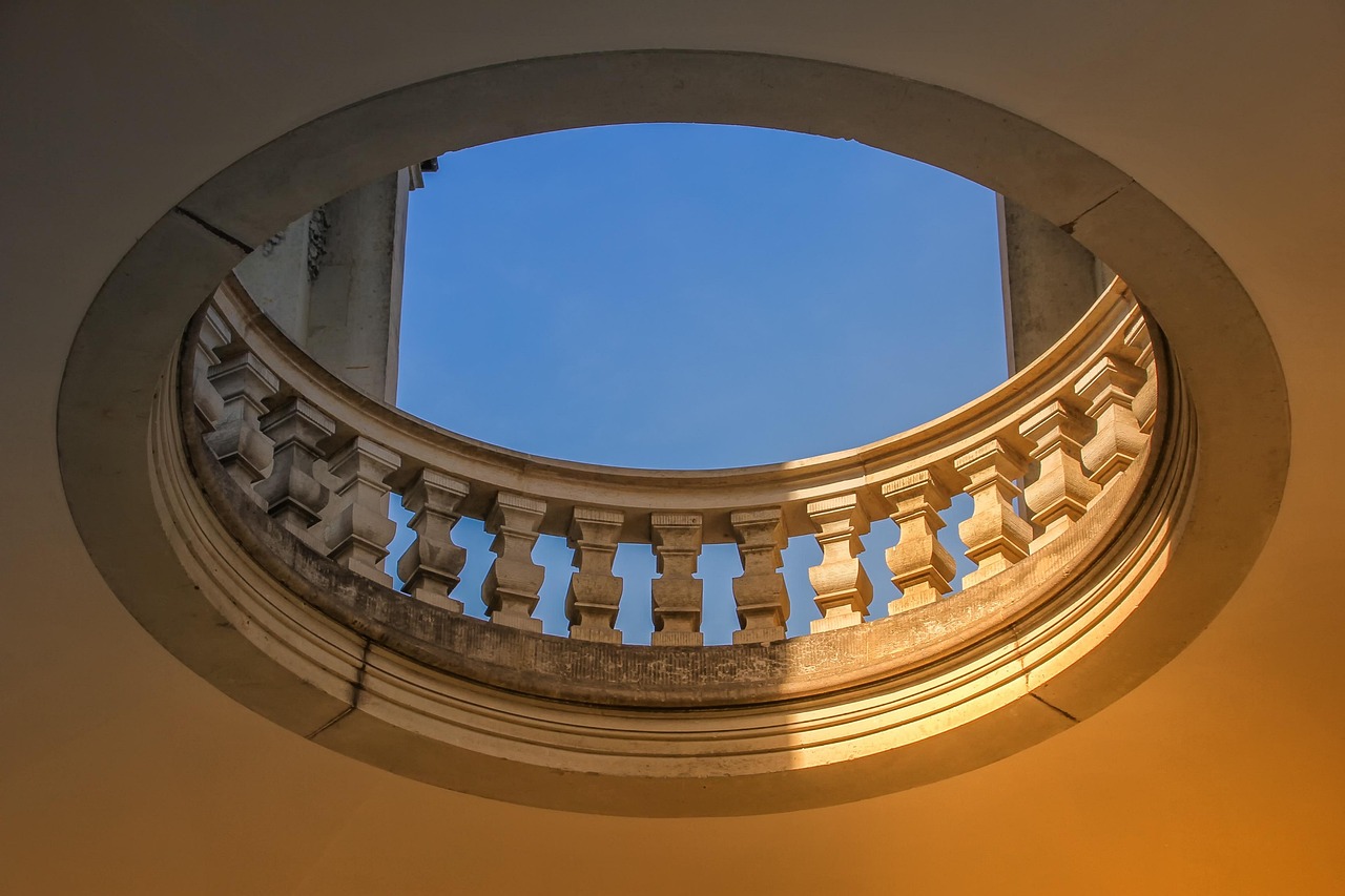 Classic stone pillars of a traditional bank building representing direct lender programs.