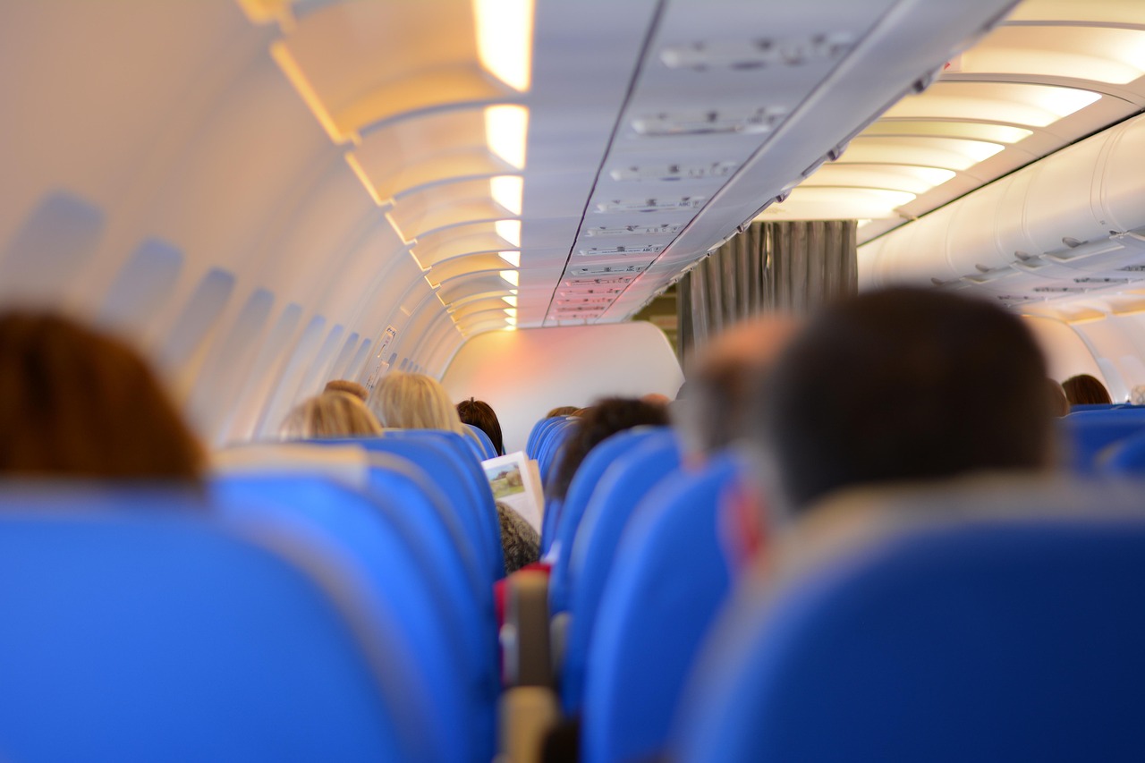 Focus on a comfortable lie-flat business class bed layout ready for a long-haul flight