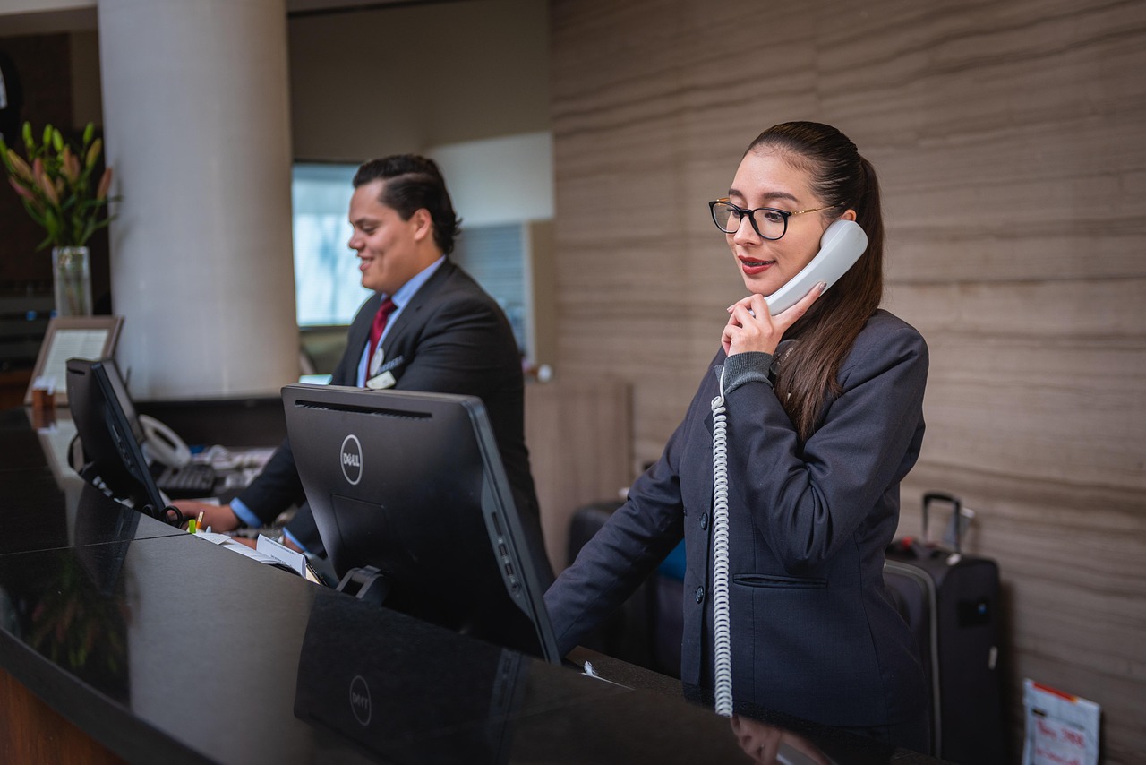 A young professional in Singaporean business attire using a smartphone.