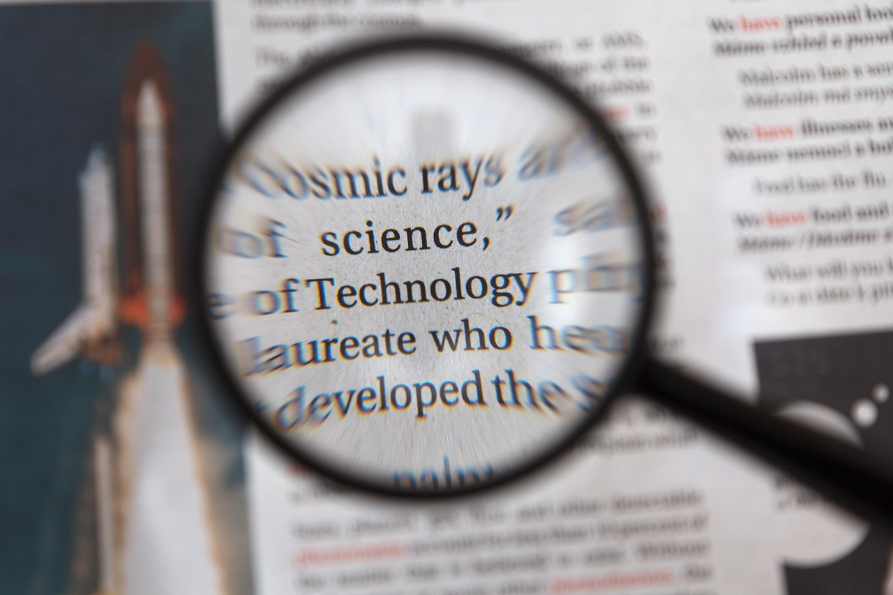 A magnifying glass inspecting fine print on a stack of financial contracts.