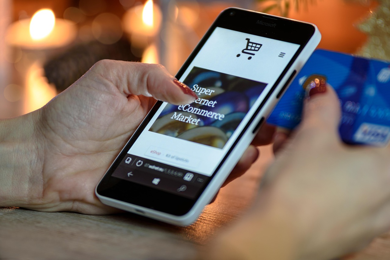 Person using a smartphone to complete a digital peer-to-peer payment transaction.
