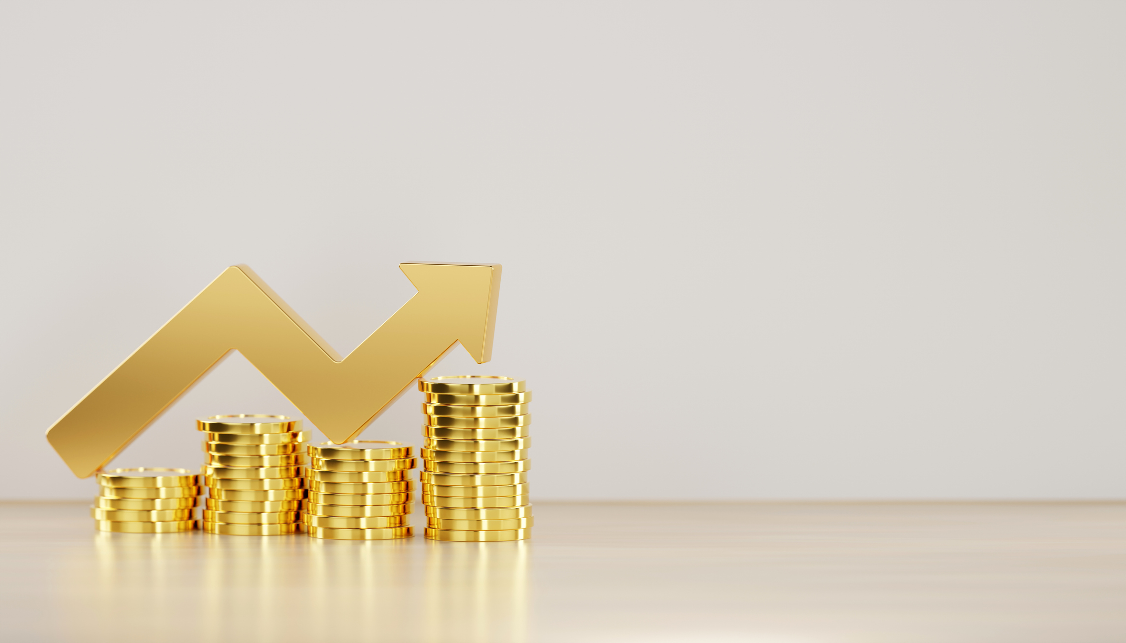 A gold arrow pointing both up and down placed atop several stacks of different sized coins.